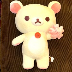 RILAKKUMA IVORY PLUSH BEAR HOLDING PINK JAPANESE CHERRY BLOSSOM PLUSH WTH BUTTON